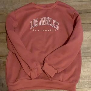 I am selling a Los Angeles sweatshirt. No stains, rips, holes, etc.